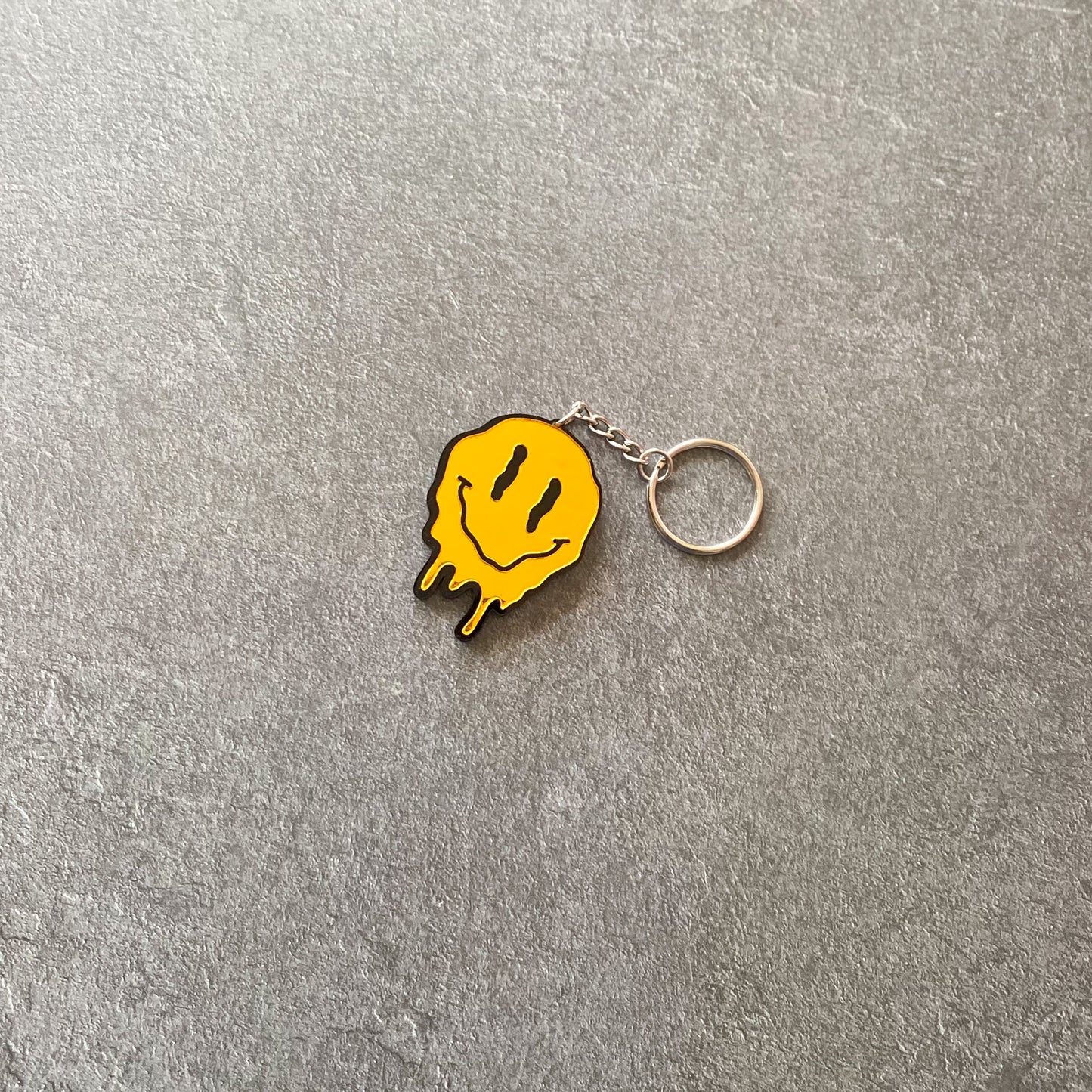 Melting Smiley face acrylic keychain